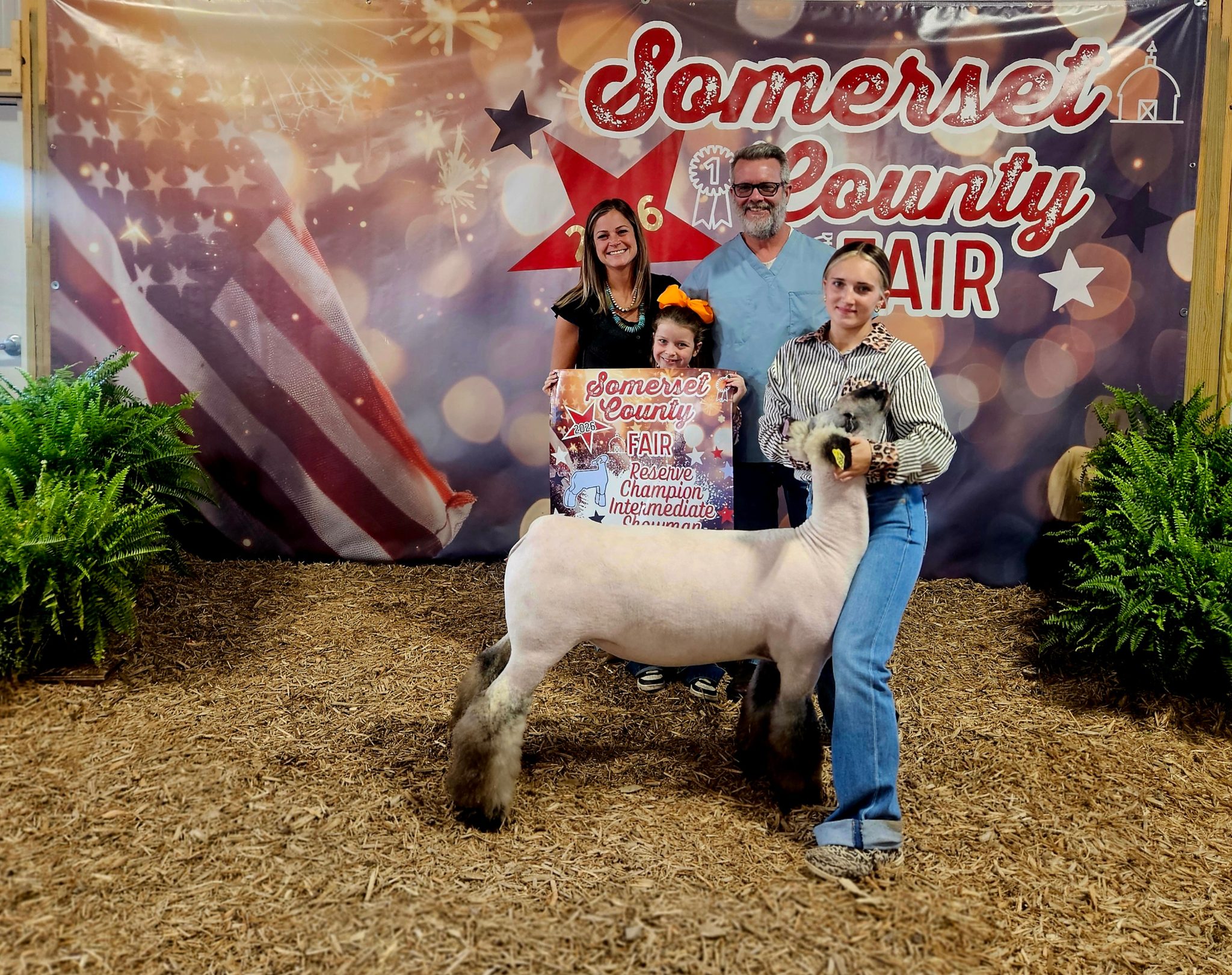 Photo of my daughter with the Hunter family who donated a lamab